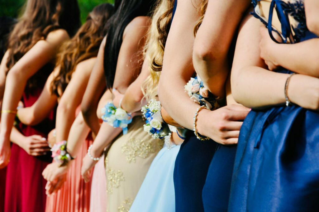 prom dresses on prom goers in a line up